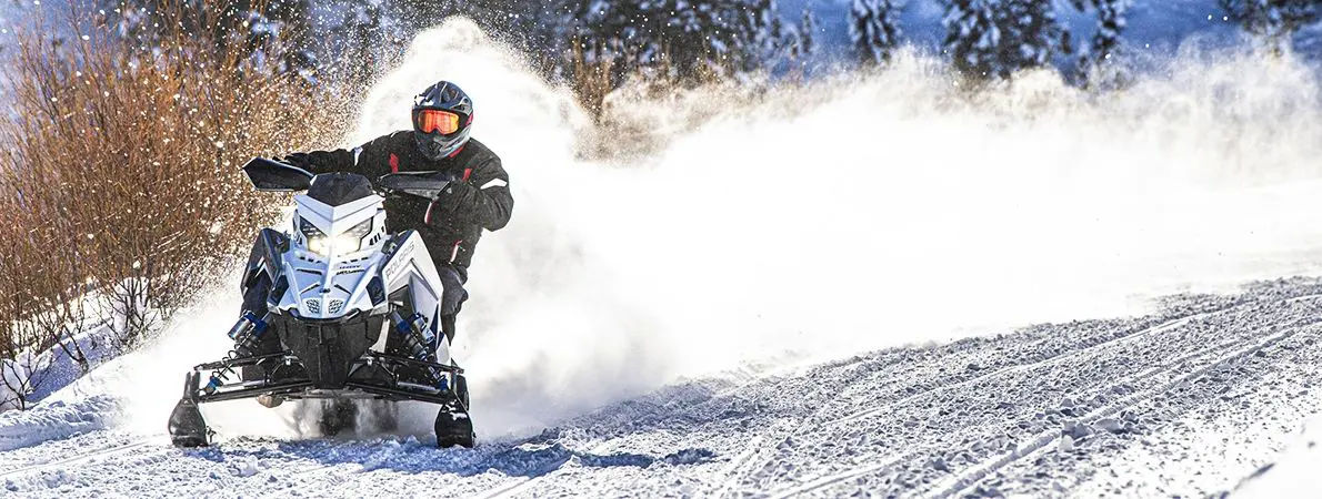 Dan Noeth riding a Snowmobile