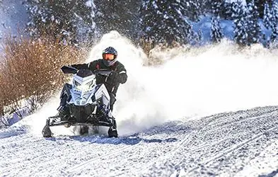 Dan Noeth riding a Snowmobile