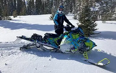 Miranda Hamlin riding a Snowmobile