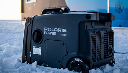 closeup of a Polaris power generator on the snow