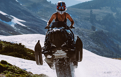 Hayley Alud riding a snowmobile