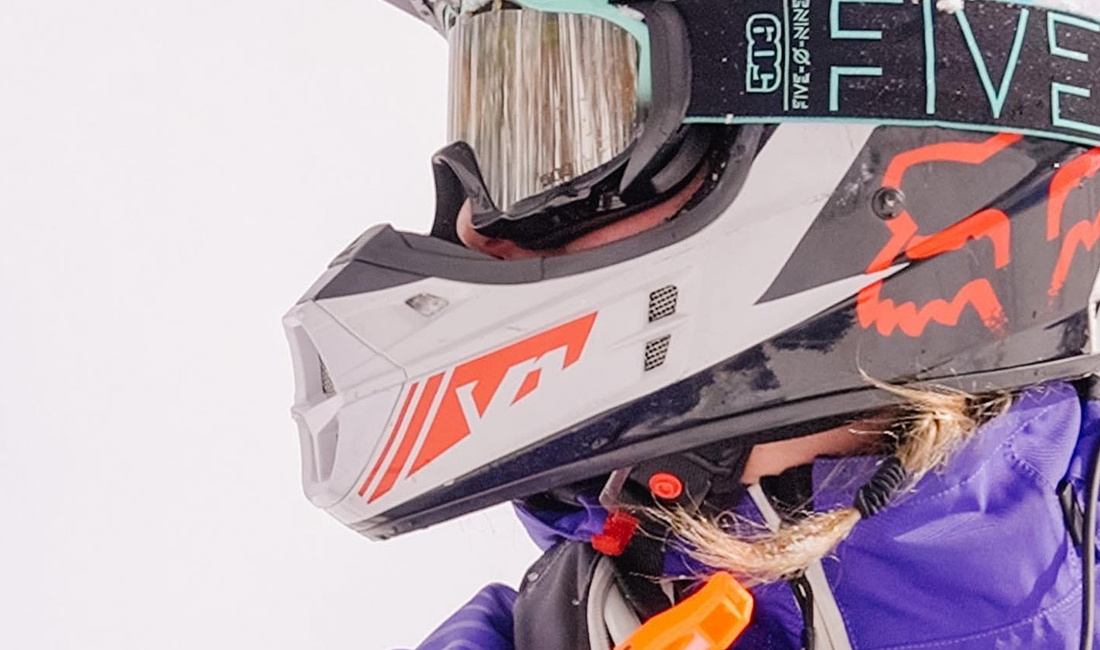 Hayley Alud riding a snowmobile
