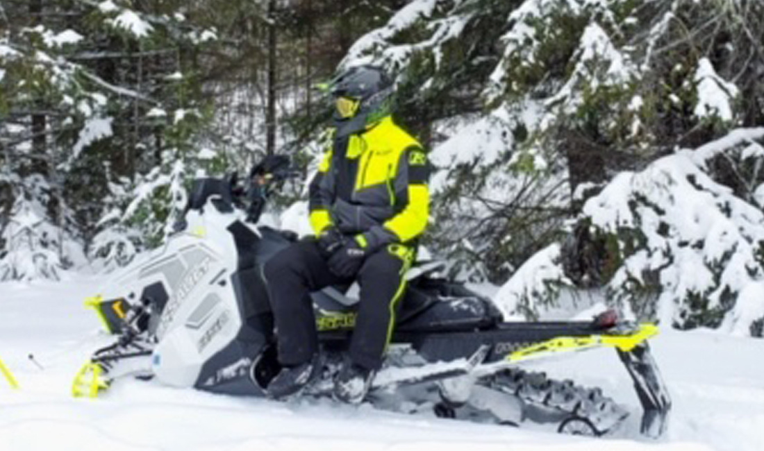 Matt Krengel riding a Snowmobile