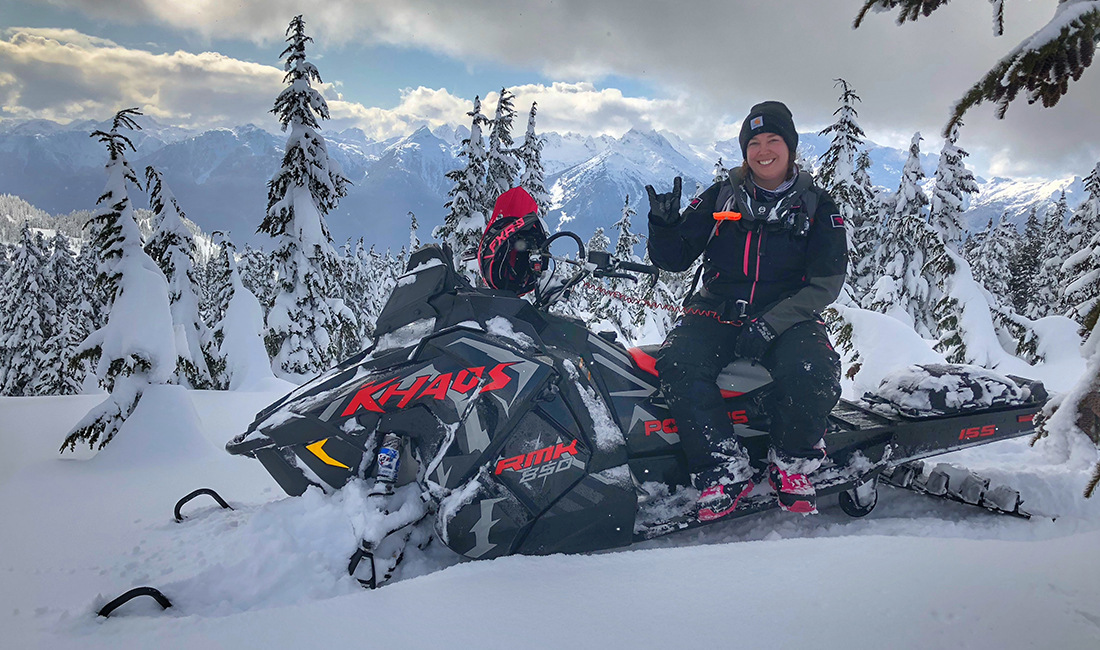 Sasha Bodie riding a snowmobile