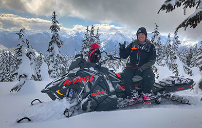 Sasha Bodie riding a snowmobile