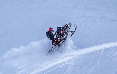 Sasha Bodie riding a snowmobile