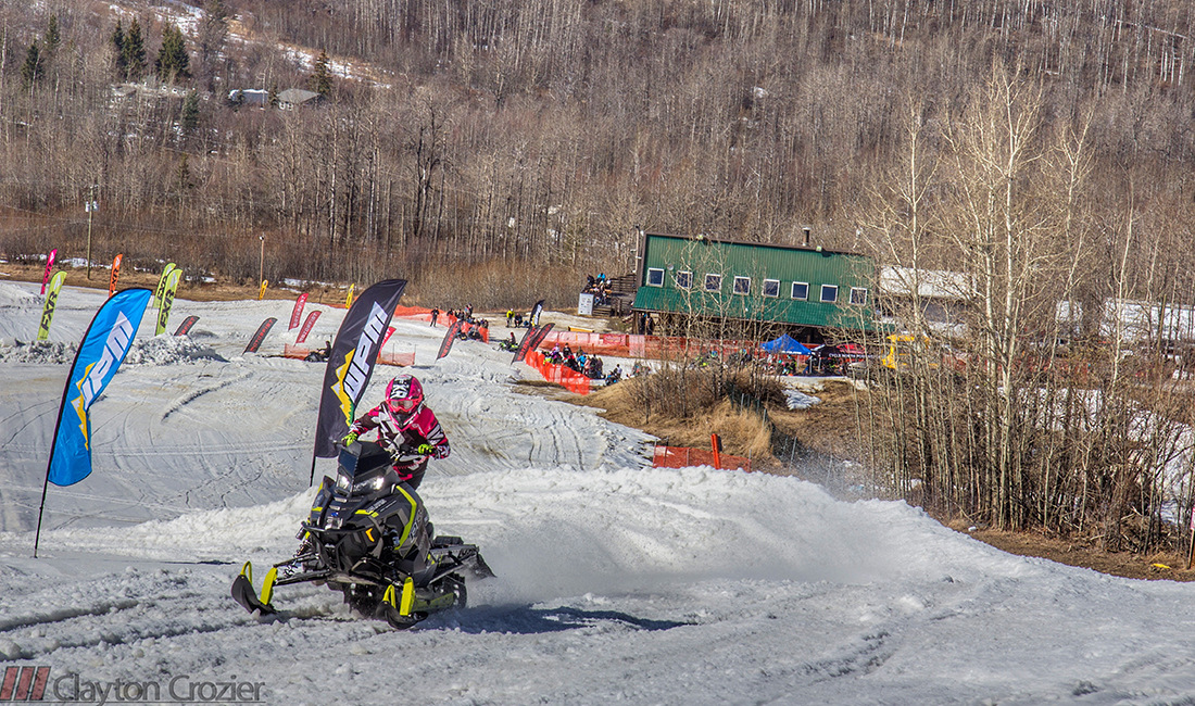 Sasha Bodie riding a snowmobile