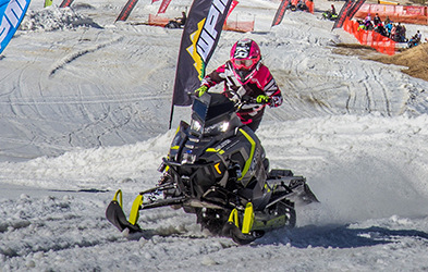 Sasha Bodie riding a snowmobile