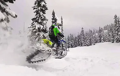 Tessa Mason riding a Timbersled