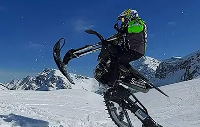 Tessa Mason jump with a Polaris Timbersled