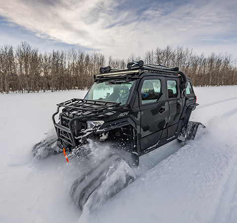 Protection from the winter elements with the enclosed cab featured on the 2025 Polaris XPEDITION ADV 5 NorthStar side-by-side.