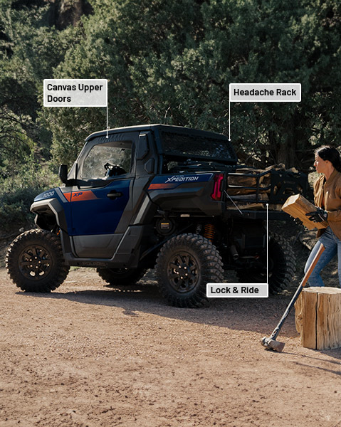Canvas upper doors, adjustable folding side mirrors, headache rack and Lock & Ride MAX bed extender accessories from the Utility Package installed on a 2025 Polaris XPEDITION XP side-by-side.