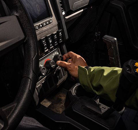 Person turning the fan settings dial inside a 2025 Polaris XPEDITION XP NorthStar side-by-side