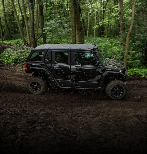 The capable 2025 Polaris XPEDITION ADV Performance Side-by-Side cruising on a trailhead.
