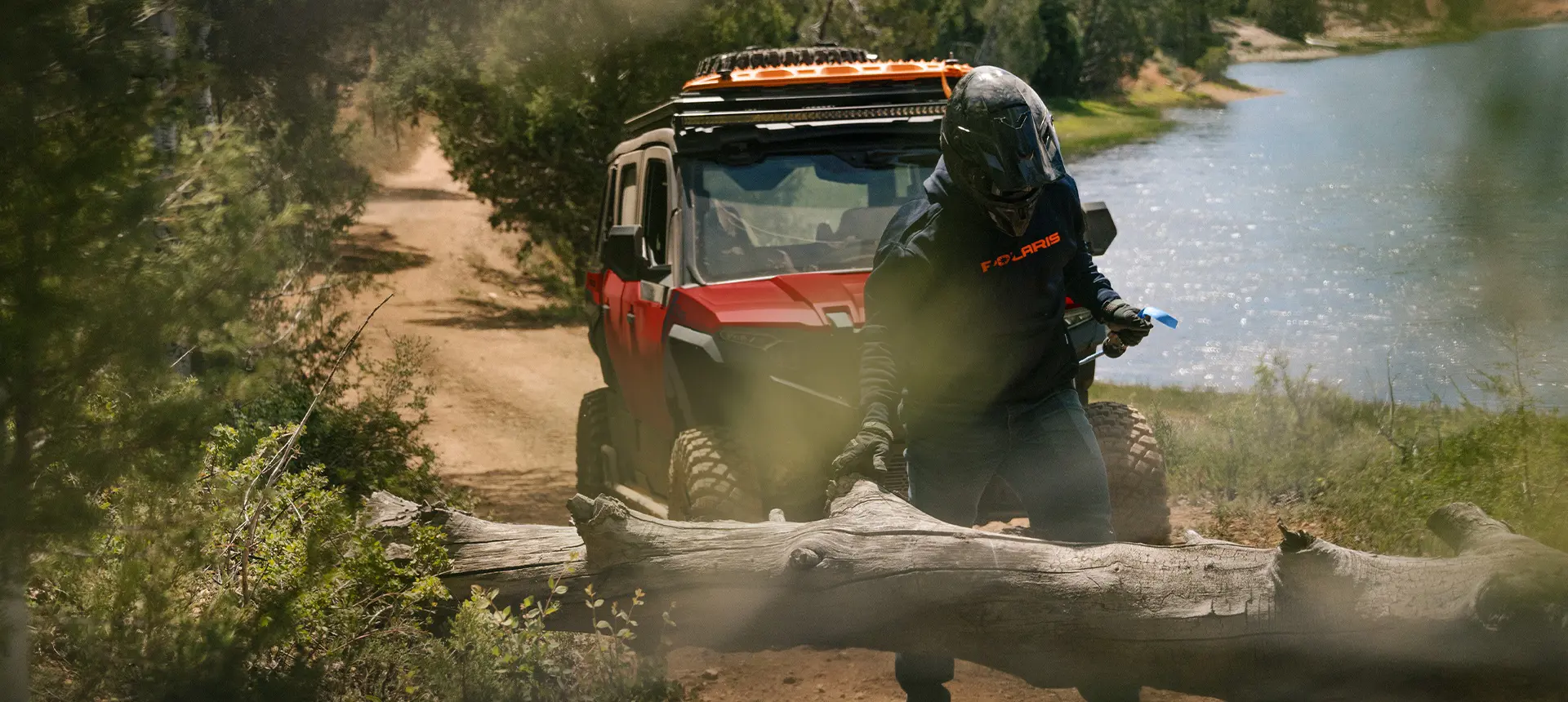 A person winching out a log with the winch installed on their 2026 Polaris XPEDITION ADV 5 performance SxS.