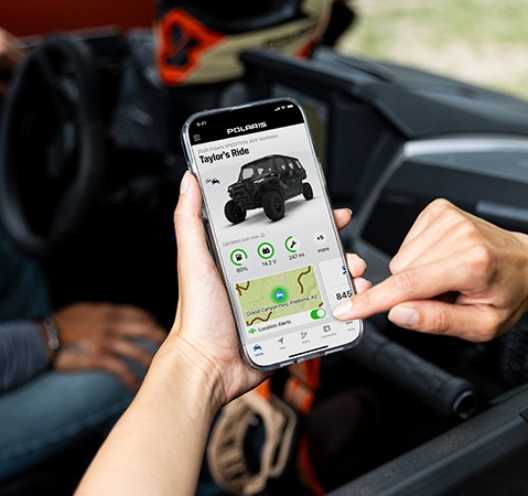 Person using the RIDE COMMAND app on their mobile for a 2026 Polaris XPEDITION ADV performance SxS.