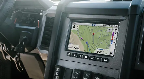 Closeup of the RIDE COMMAND touch screen in the all-season cab of a 2026 Polaris XPEDITION ADV NorthStar performance SxS.