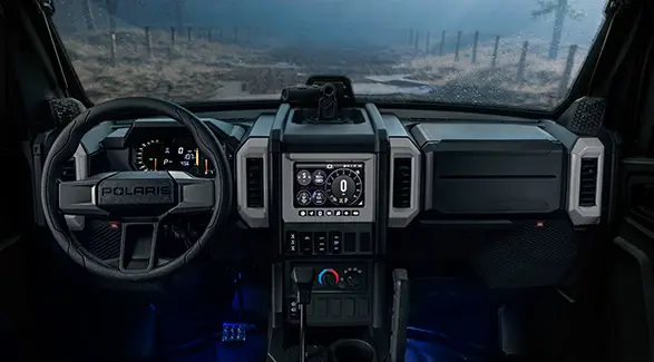 Interior view of the cab of a 2026 Polaris XPEDITION ADV NorthStar performance side-by-side.