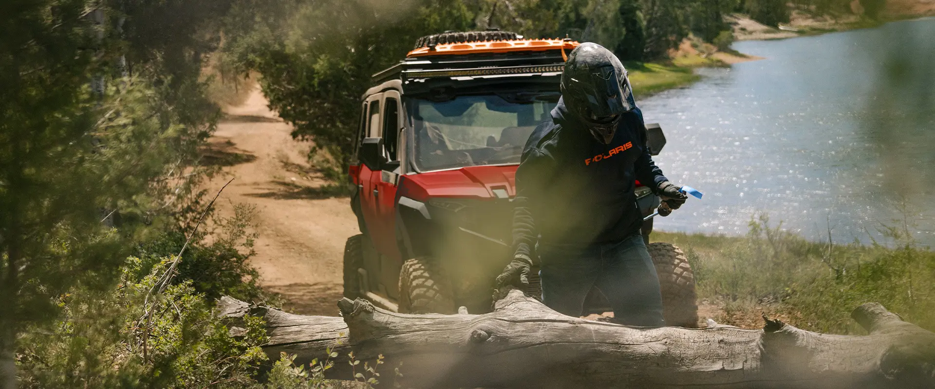 A person using the winch from their 2026 Polaris XPEDITION ADV 5 NorthStar performance side-by-side.