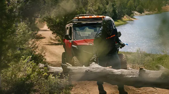 A person using the winch from their 2026 Polaris XPEDITION ADV 5 NorthStar performance side-by-side.