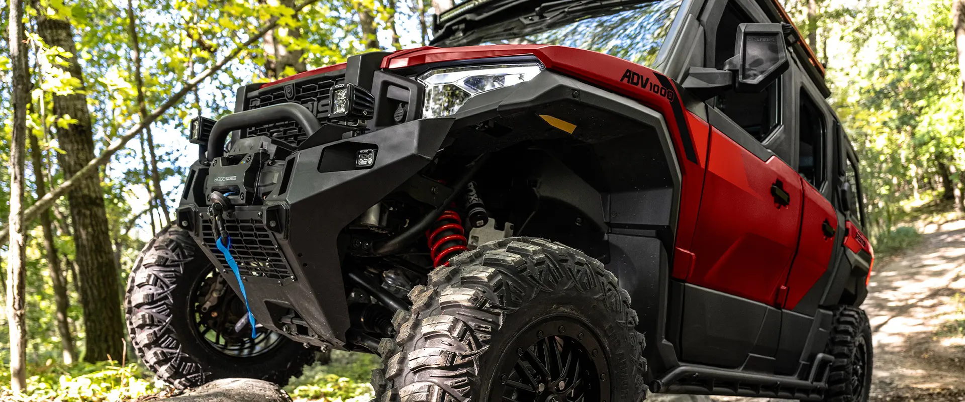 Front-end closeup of a 2026 Polaris XPEDITION ADV NorthStar performance side-by-side.