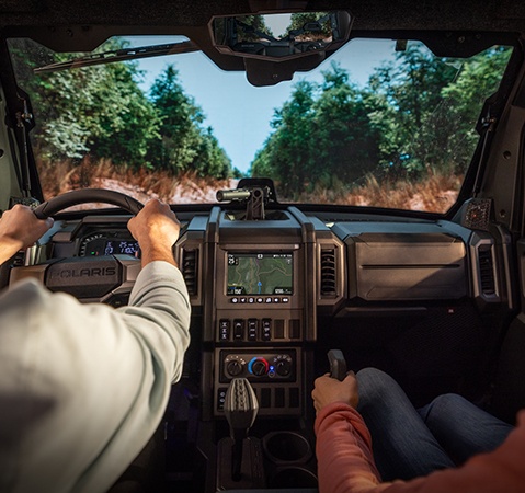 2 riders inside of a 2026 Polaris XPEDITION XP NorthStar SxS.
