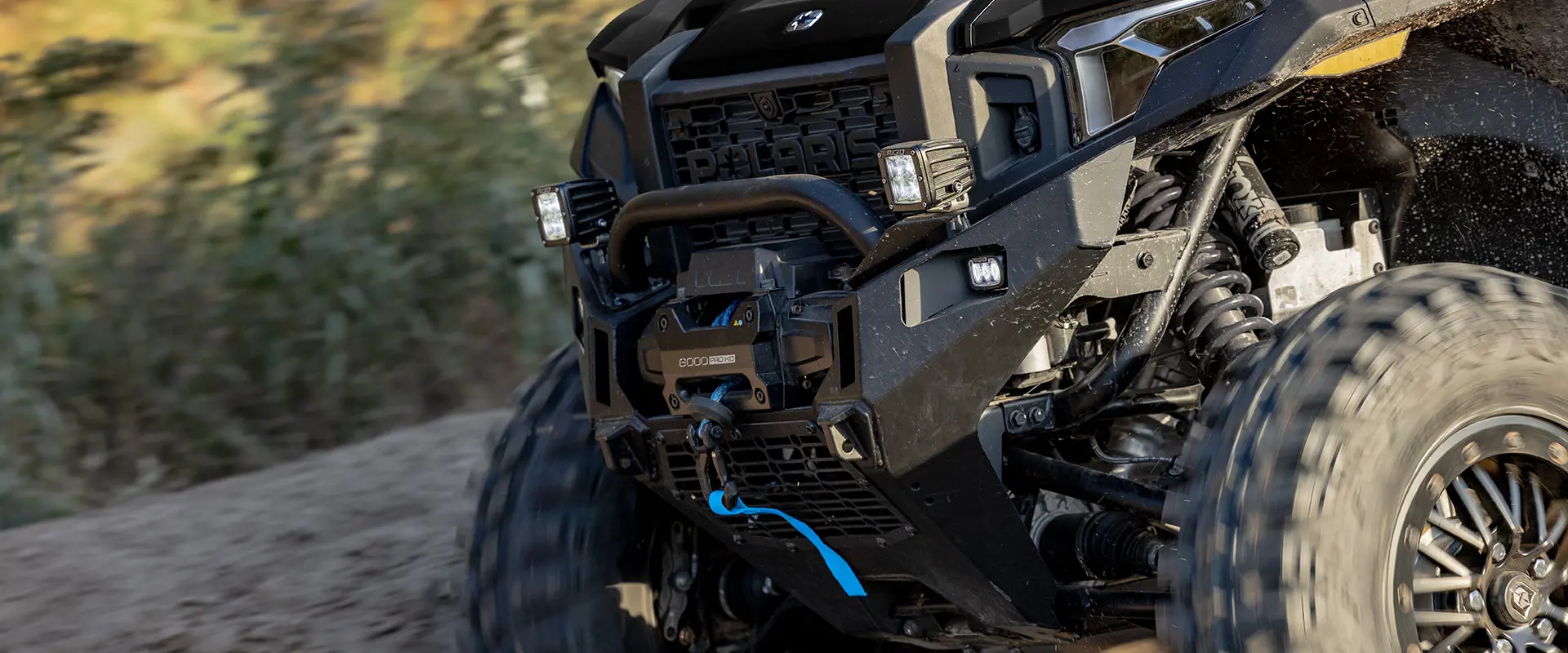 Front end view of a 2026 Polaris XPEDITION XP NorthStar side-by-side showcasing the 6,000 lb winch.