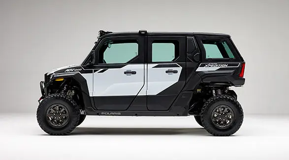 Side profile of a Ghost White Metallic 2027 Polaris XPEDITION ADV 5 NorthStar side-by-side.