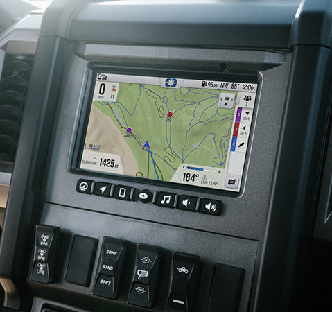 RIDE COMMAND touch screen in the enclosed cab of a 2027 Polaris XPEDITION XP side-by-side.